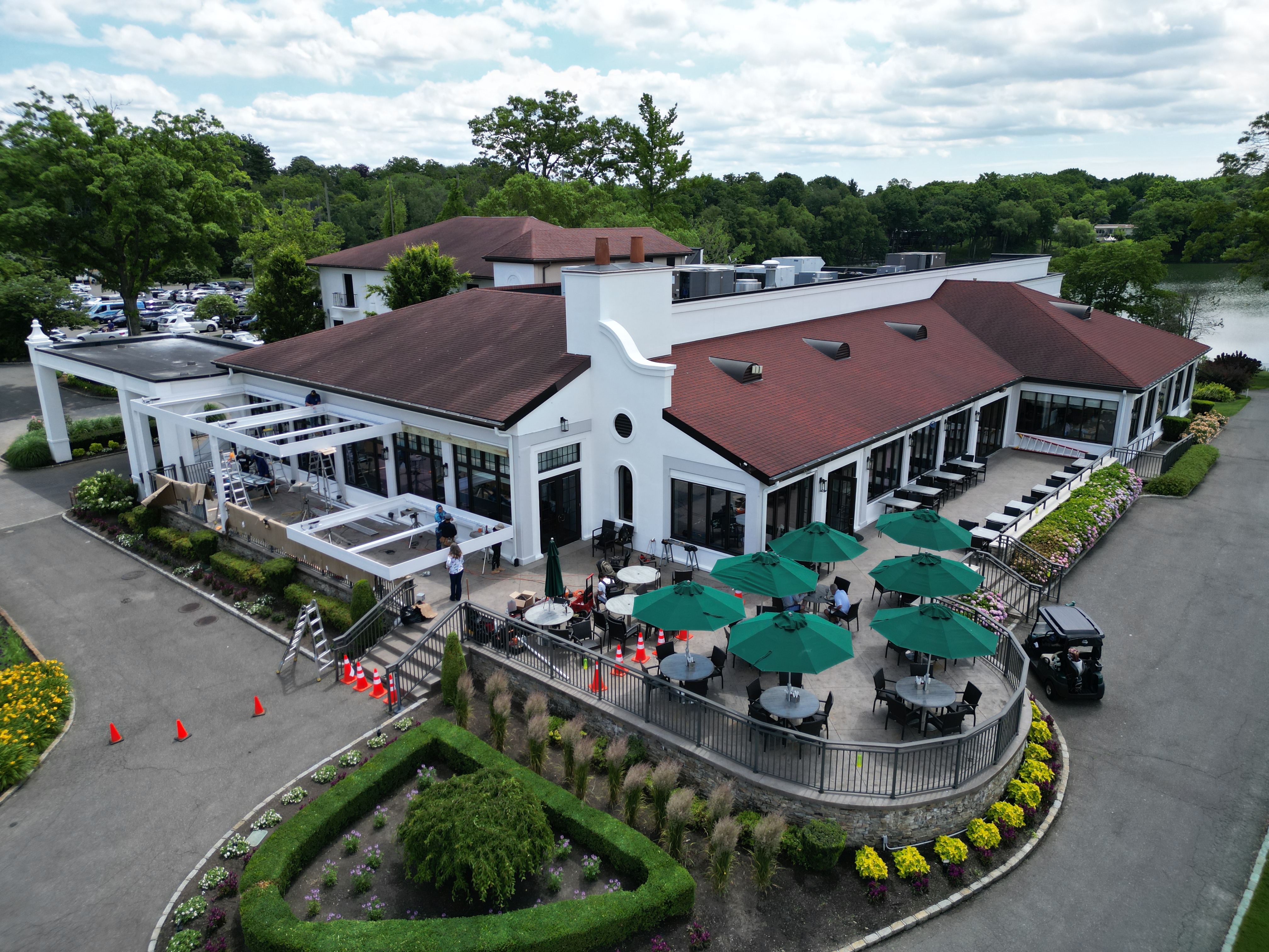 Lake Success Country Club aerial view BEFORE the Breslow louvered roof installation — open terrace under construction