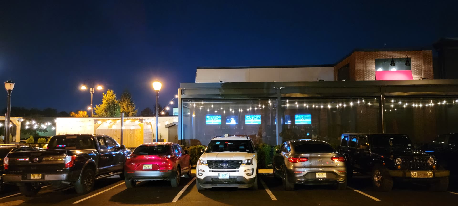 Tommy's Tavern + Tap Clifton commercial louvered roof — evening