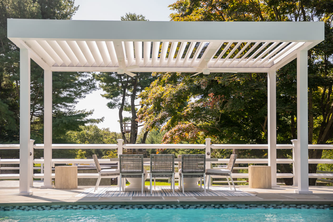 Classic pergola with columns beside a pool