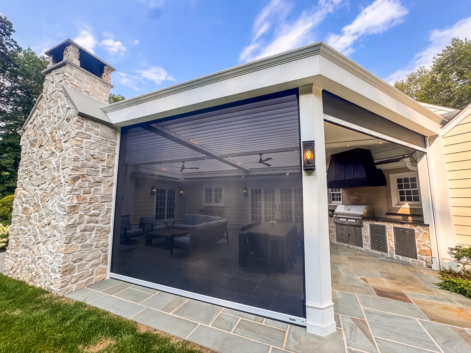 Armonk, NY transitional pergola — custom trim and concealed motorized shades