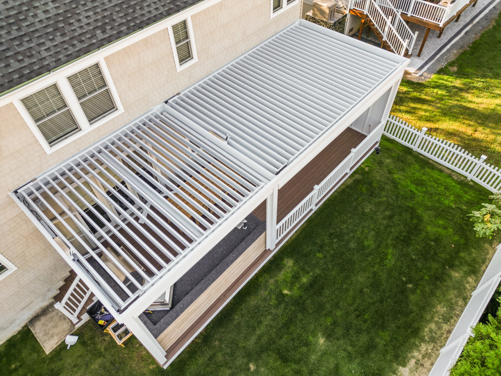 Breslow deck-mounted louvered roof + tv wall + outdoor kitchen build, Monmouth Beach, NJ