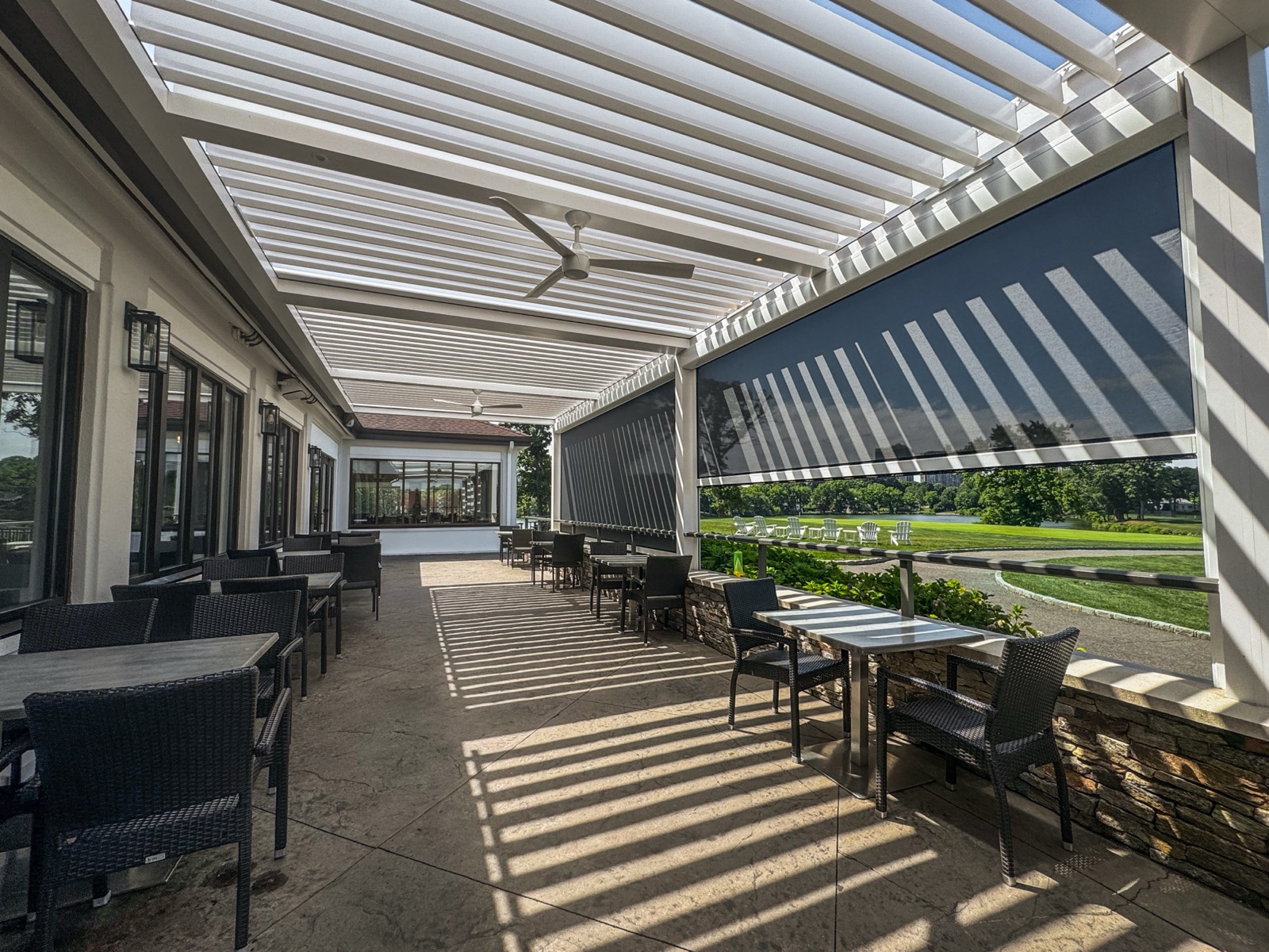 Motorized retractable screen shade installed by Breslow Design & Build
